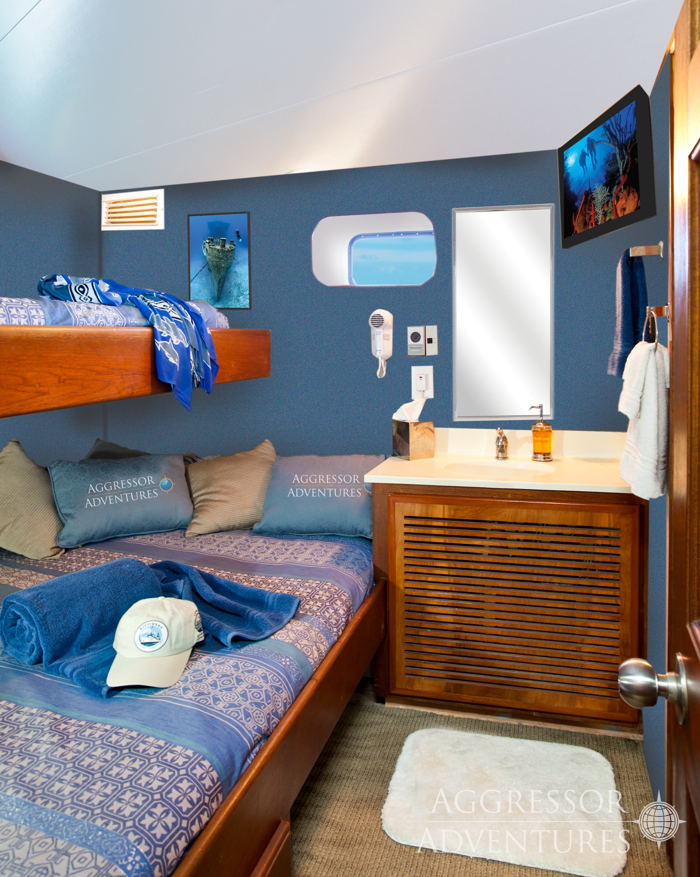 deluxe stateroom with bunk style single above double bed on Cayman Aggressor IV
